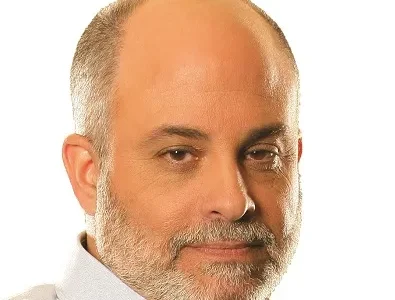 Mark Levin with grey beard, and light collared shirt against a plain white background.