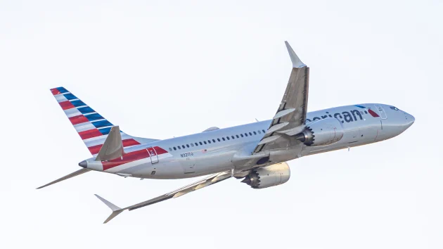 Passengers exit plane via emergency slide after aborted takeoff