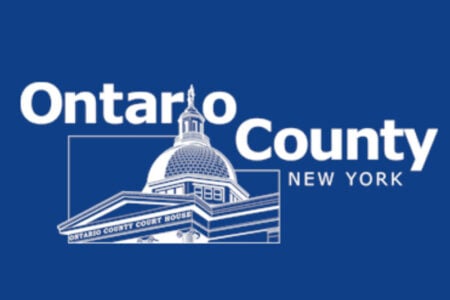 Logo for Ontario County, NY, featuring a white line drawing of the Ontario County Court House on a blue background.