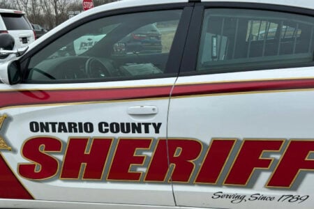 Close-up of an Ontario County Sheriff patrol car parked on an overcast day.