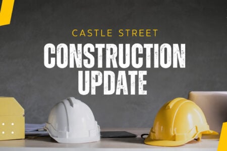Graphic: Construction update for Castle Street with hard hats and a house model on a desk.