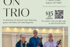 The Early On Trio with a recorder, guitar, and viola da gamba pose indoors.