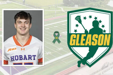 Headshot of a smiling Hobart lacrosse player with a green Gleason logo and an LG ribbon, set against a sports field.