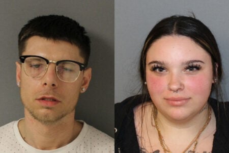 Police booking photos show a man in glasses and a woman with nose piercings side-by-side against a plain background.
