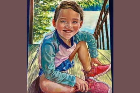 Painting: Smiling young boy in a blue and pink swim shirt crouches on a sunny wooden dock by a lake with trees.