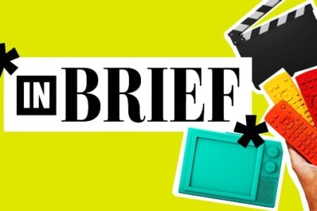 IN BRIEF" text on yellow, with a film clapboard, retro TV, and a hand holding orange, yellow, and red remote controls.