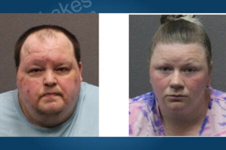 Two individuals in mugshots: a man in a light blue shirt and a woman in a pink and purple tie-dye shirt.