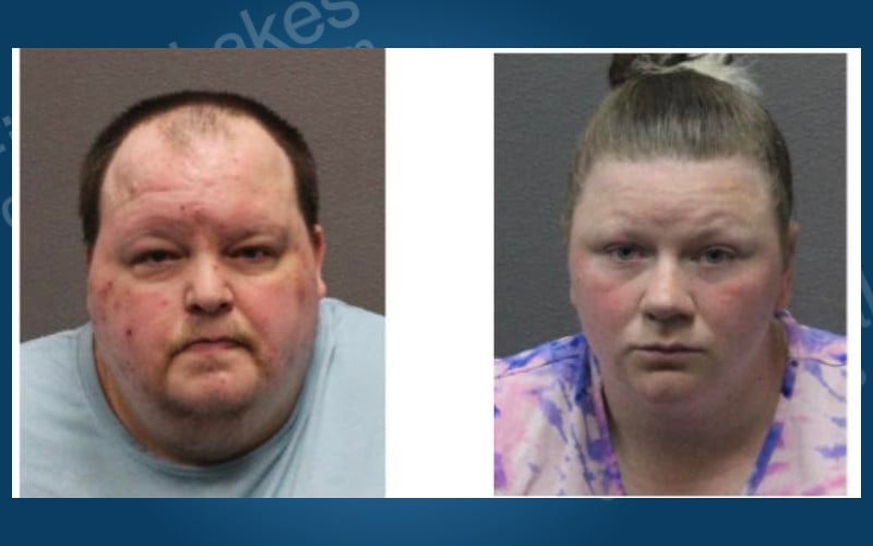 Two individuals in mugshots: a man in a light blue shirt and a woman in a pink and purple tie-dye shirt.