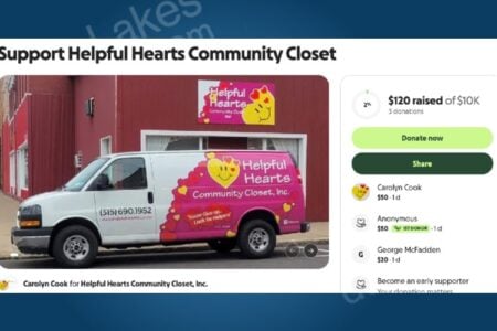 Helpful Hearts Community Closet van, white with pink and yellow branding, parked outside a red building.