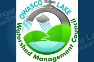 Owasco Lake Watershed Management Council logo: a faucet and rain cloud pouring water onto hills and a lake.