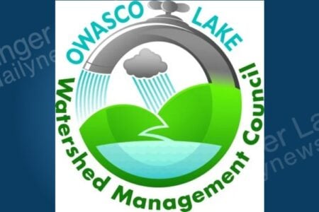 Owasco Lake Watershed Management Council logo: a faucet and rain cloud pouring water onto hills and a lake.