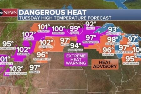 Weather map displays Tuesday's dangerous high temperature forecasts for central and northern US, with extreme heat warnings and advisories.