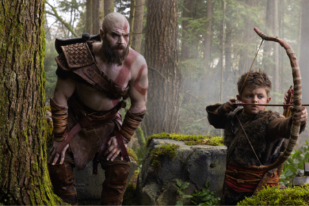 Bald, bearded man with red markings watches young boy aim bow and arrow in a misty forest.
