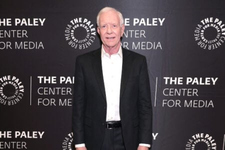 Captain Chesley "Sully" Sullenberger smiles in a black suit against The Paley Center for Media backdrop.