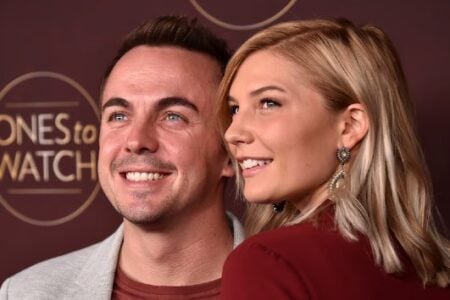 Actor Frankie Muniz and Paige Price smile at a "Ones to Watch" red carpet event.