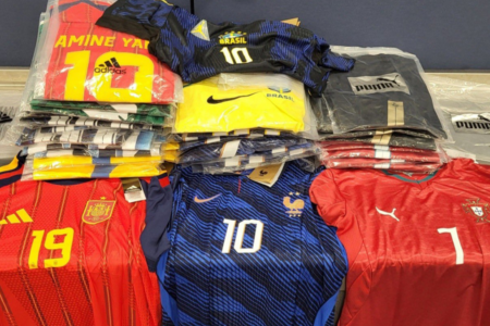 Counterfeit sports jerseys, including Adidas, Nike, and Puma, displayed after being seized by CBP at the Port of Rochester, NY.