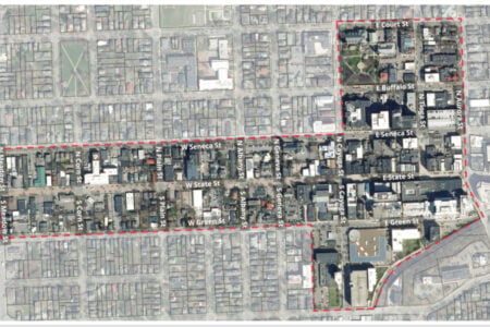Aerial map outlining an L-shaped district in downtown Ithaca, featuring State and Seneca Streets.